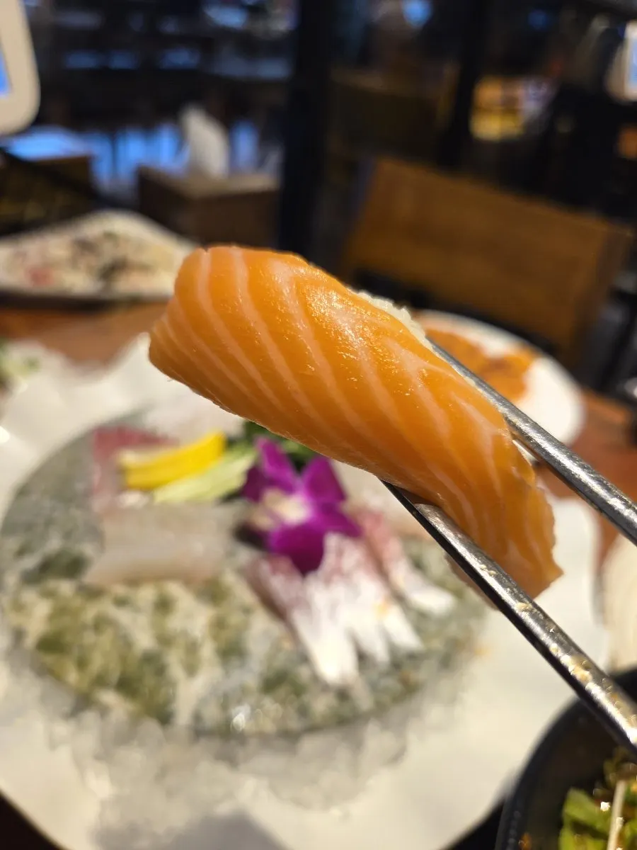 A plate of sushi portioned for the number of diners