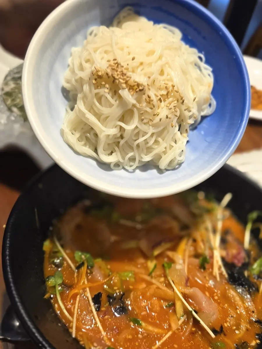 Somyeon noodles swirled into the icy mulhoe broth
