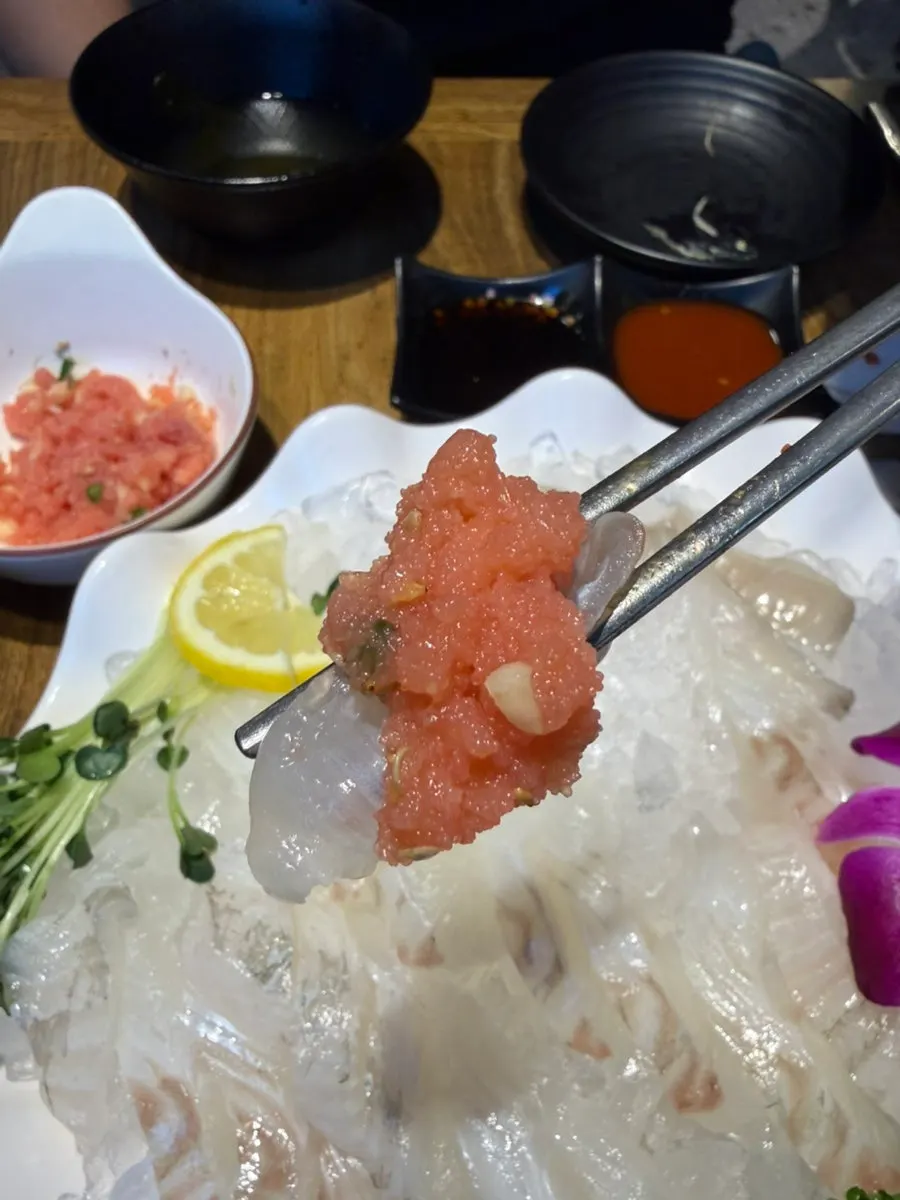 A single serving plate of springy flounder sashimi