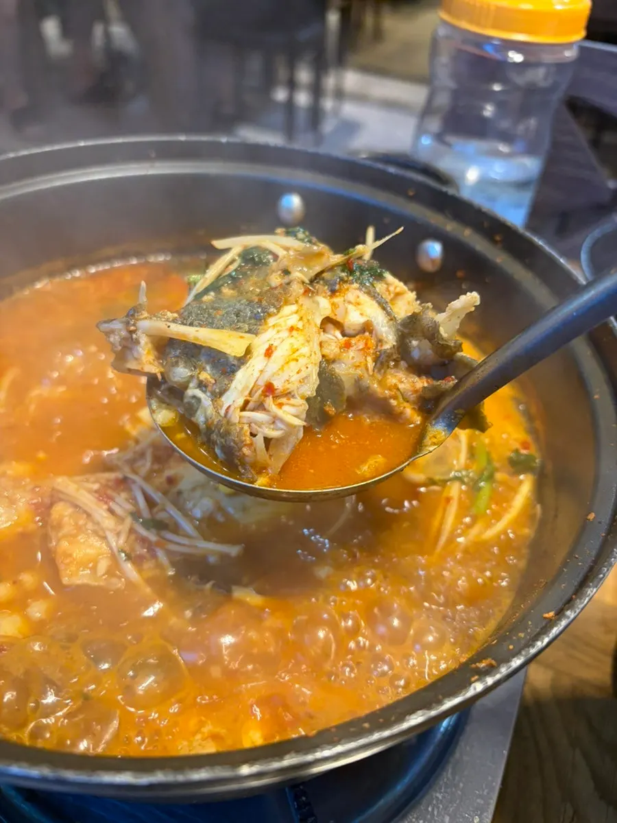 Fish bone soup bubbling away in a large pot