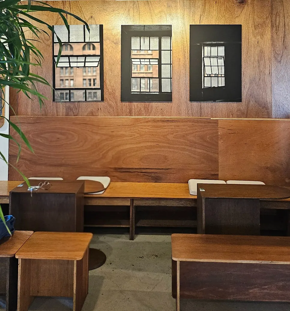 Wall of framed photos that look like windows