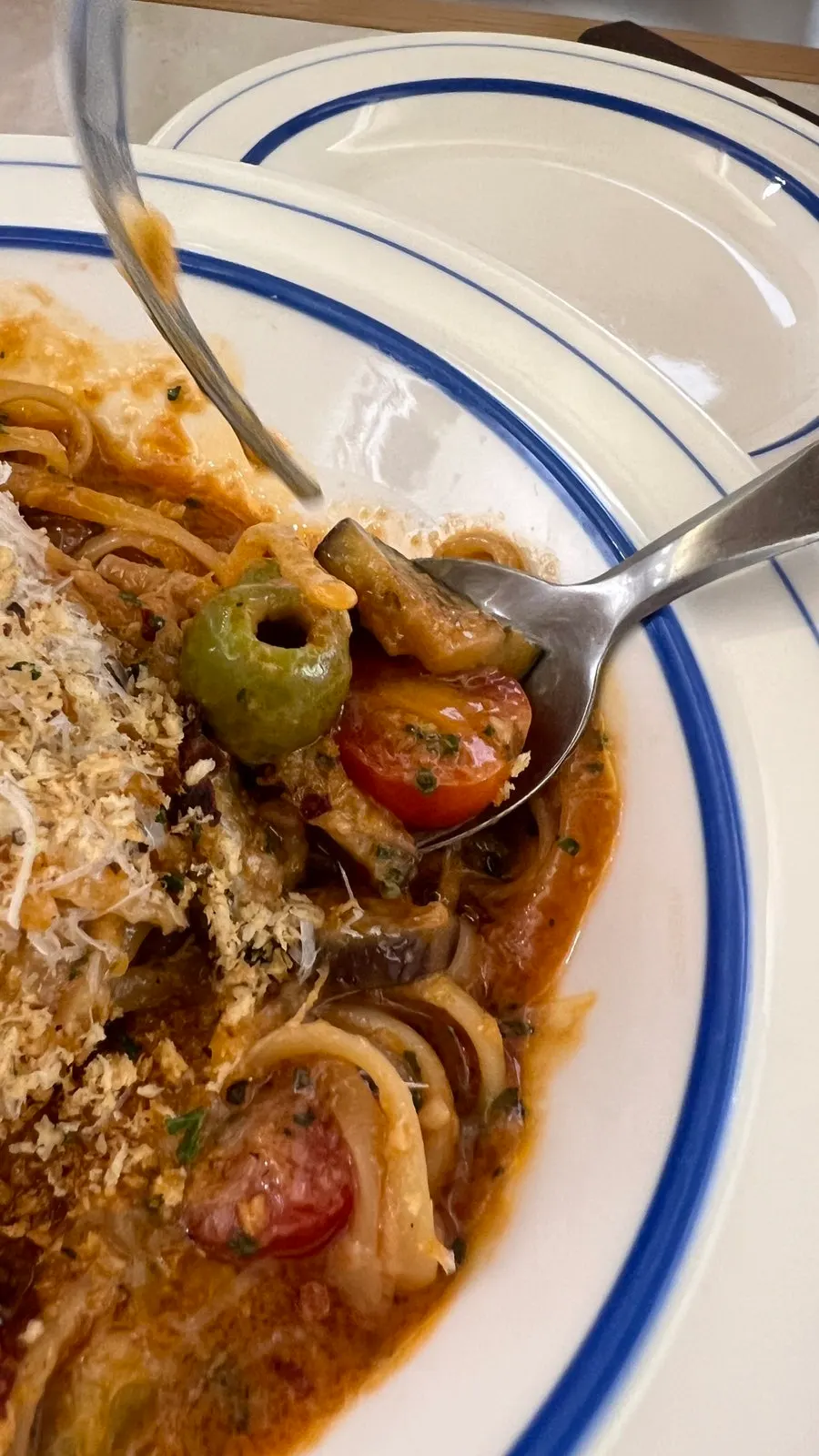 Close-up of the pasta showing olives and cherry tomatoes