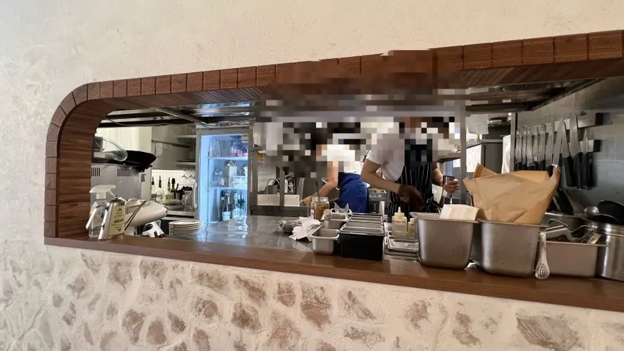 Open kitchen preparing lasagna