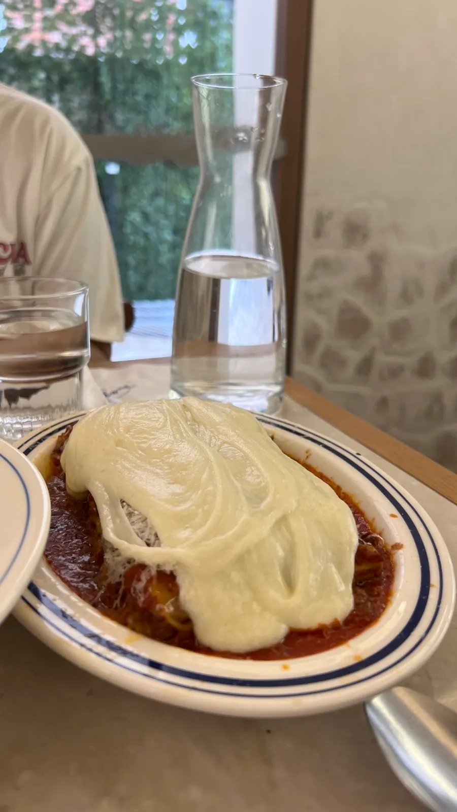 Cheese stretching long from the lasagna