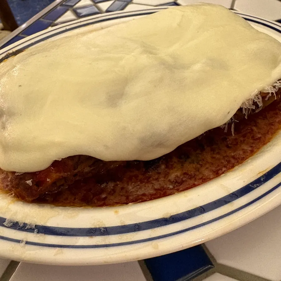 Alfredo cheese lasagna fully covered in cheese
