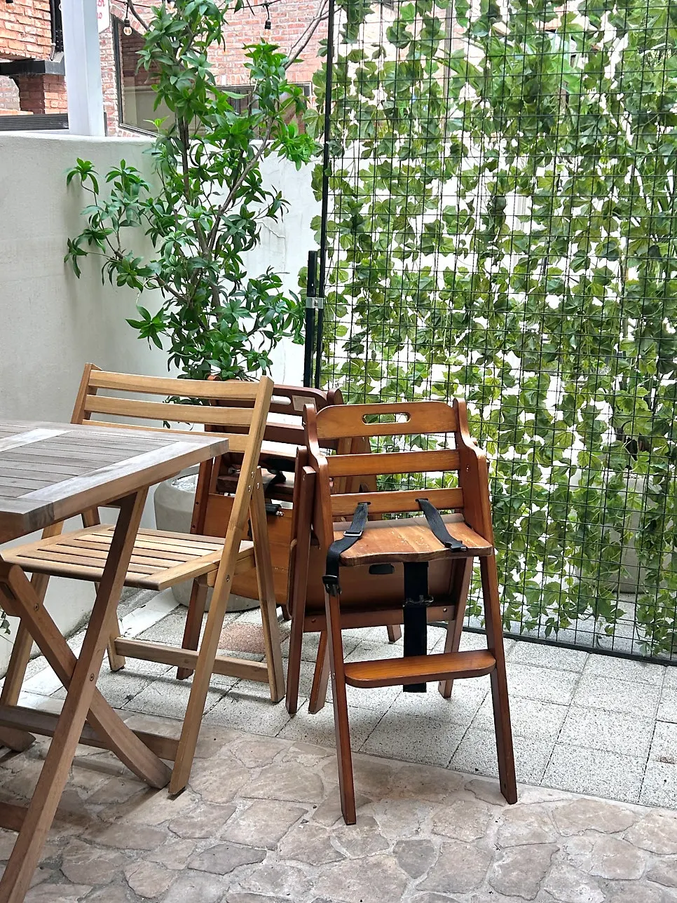 Inner terrace seating surrounded by greenery