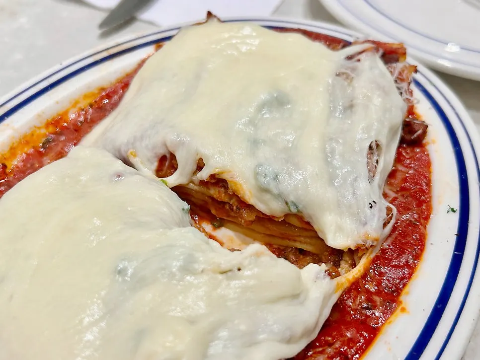 Alligot cheese lasagna with the cheese waterfall poured on