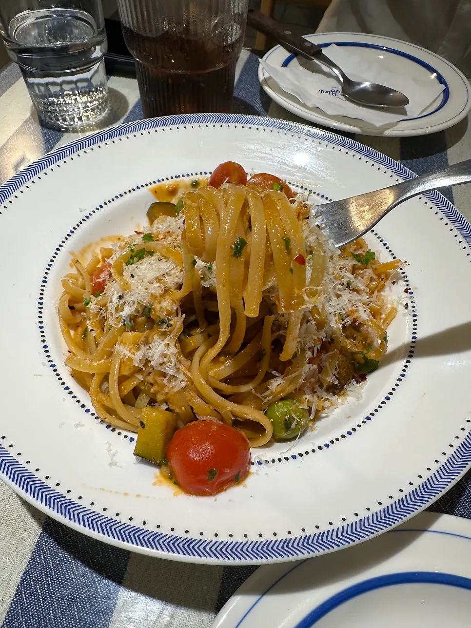 Puttanesca pasta noodles lifted with a fork