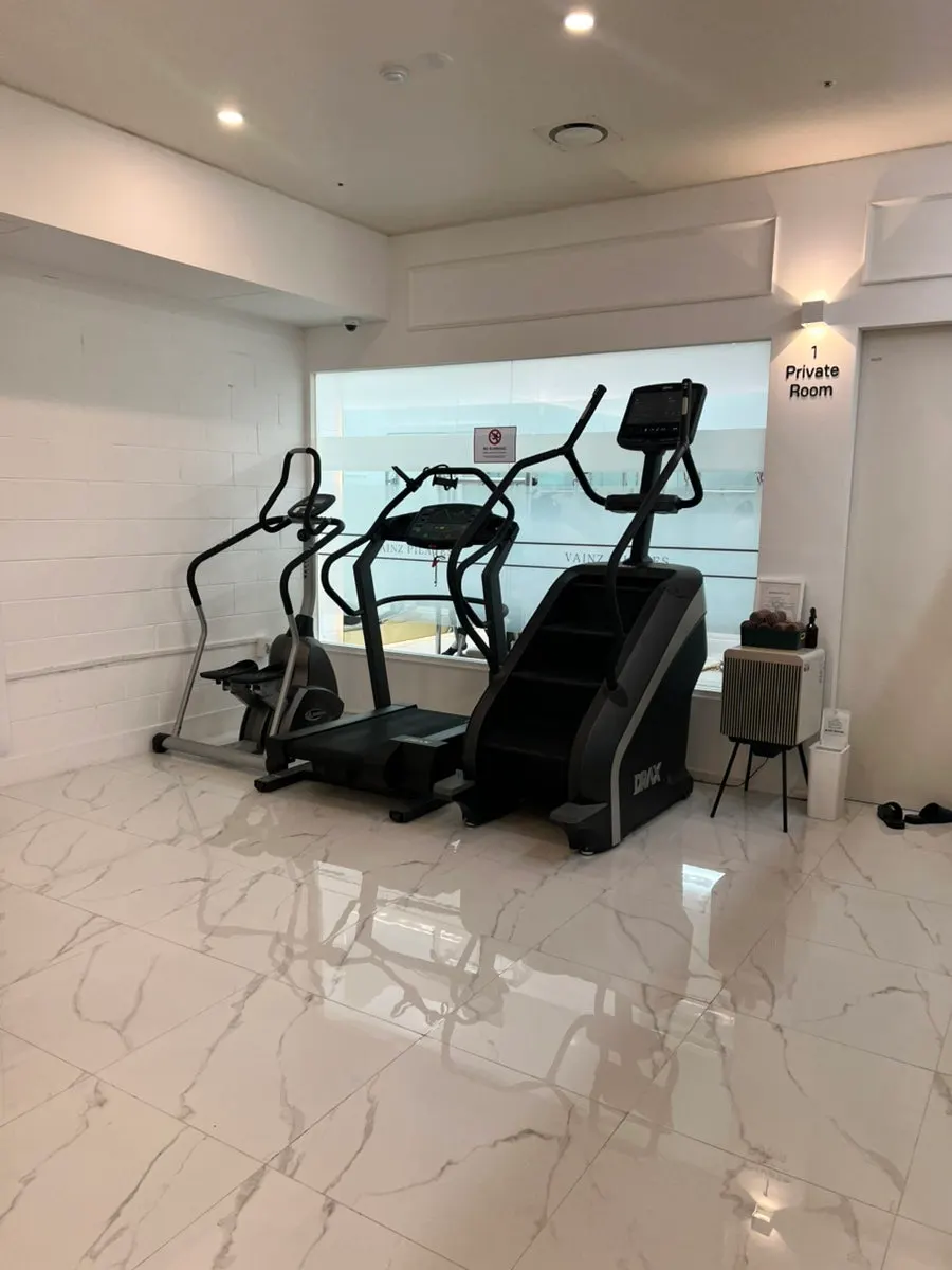 Cardio zone with a stairmaster and treadmill