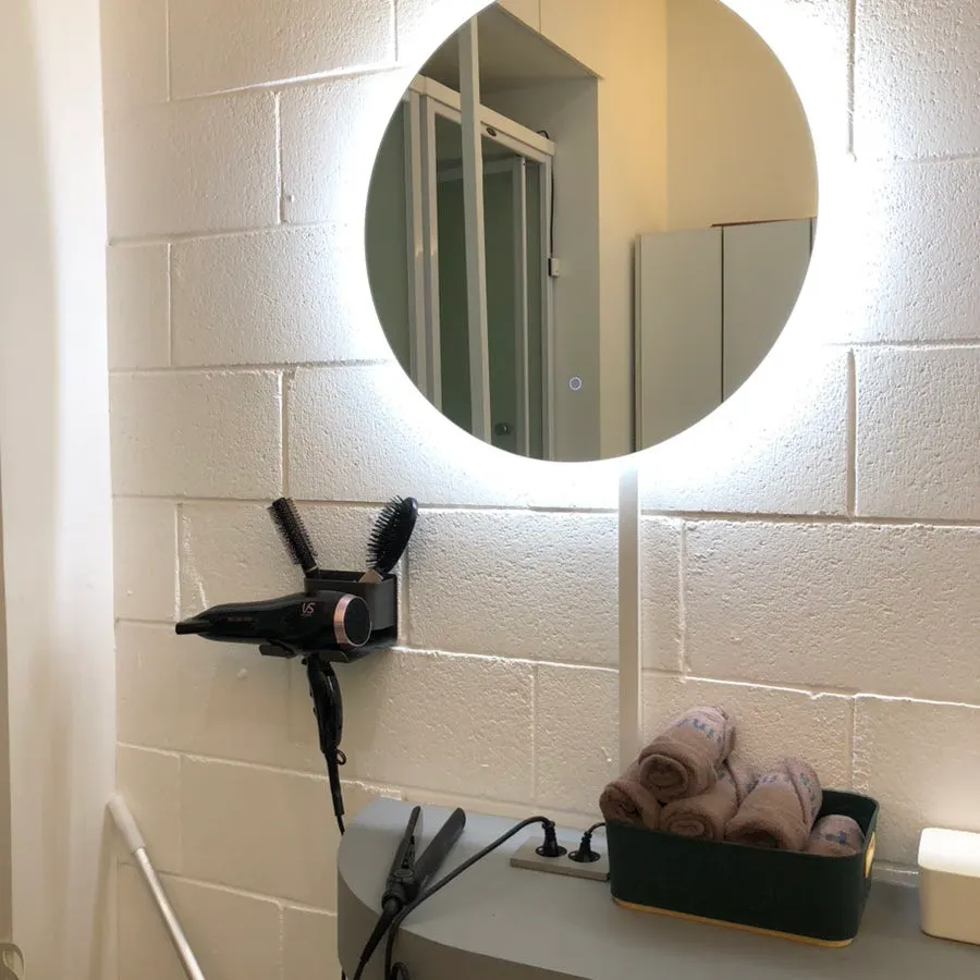 Hair dryer and towels ready in the shower area