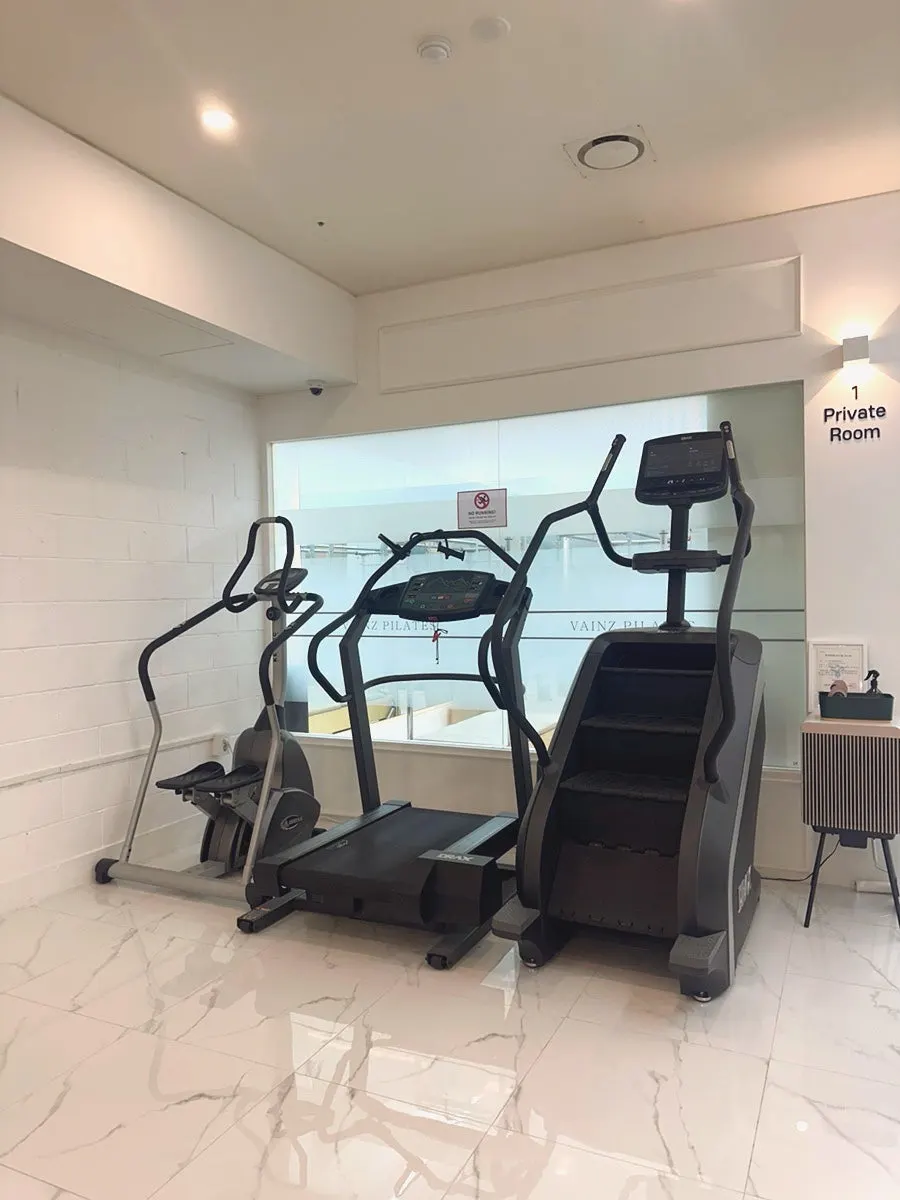 Cardio equipment inside the studio's cardio zone