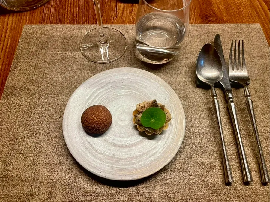 Starter of chicken liver cocoa choux and abalone tofu finger food