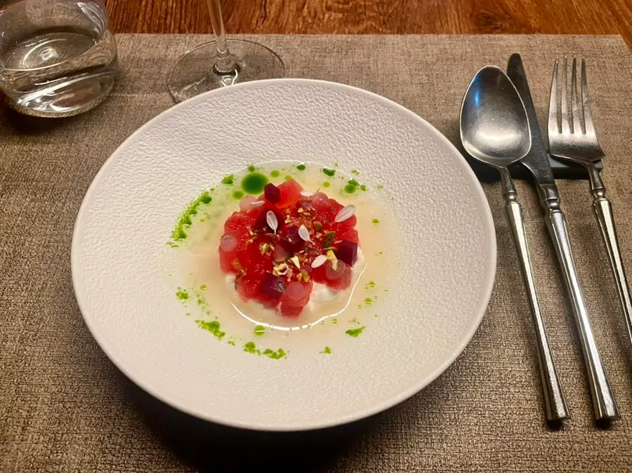 Smoked watermelon, stracciatella, and tomato water appetizer