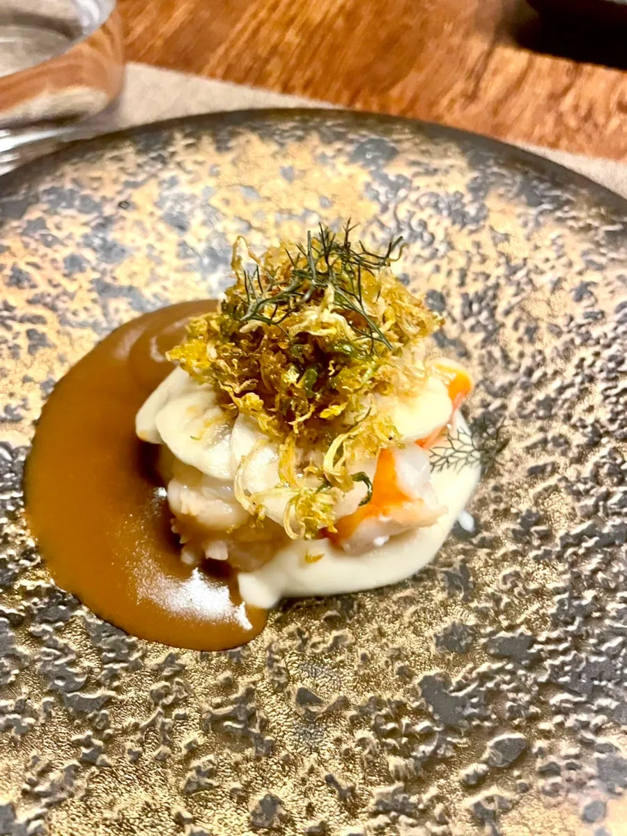 Shrimp dish served with bisque sauce for dipping