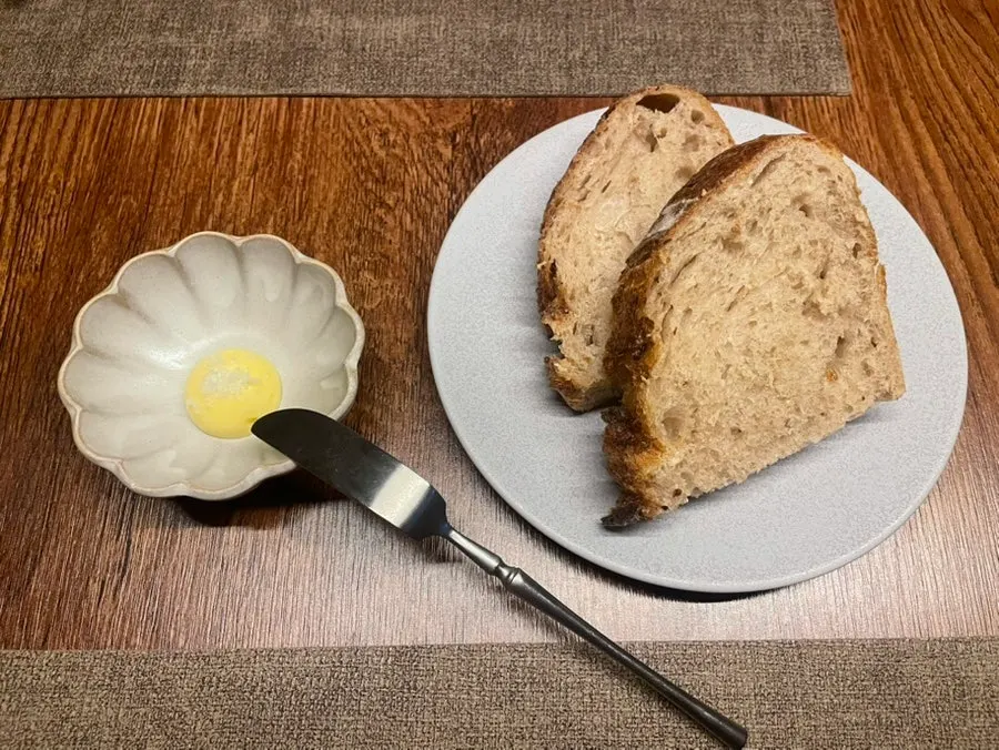 House-fermented baked bread with butter and Maldon salt