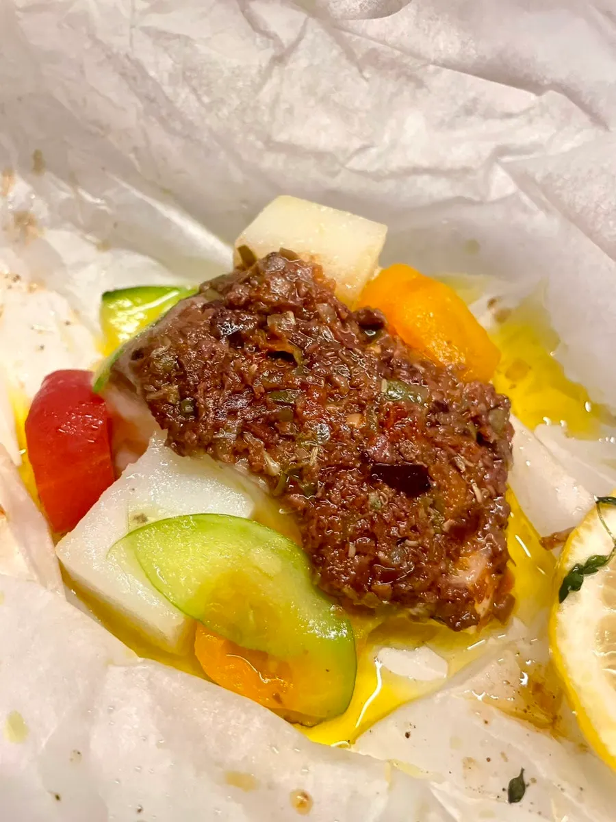 Close-up of sea bream topped with tapenade