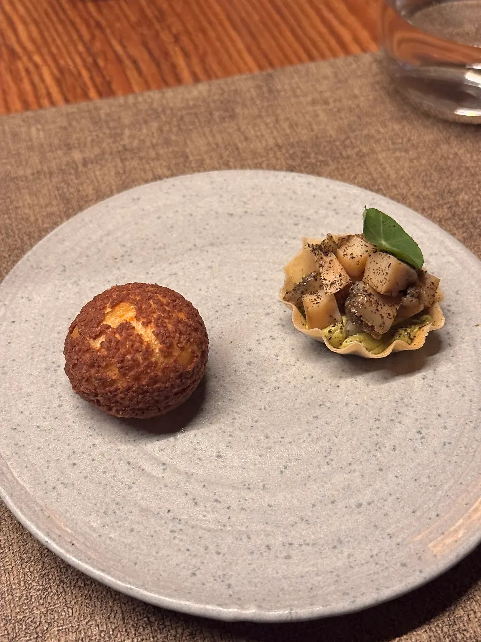 Dinner course starter: chicken liver cocoa choux and abalone tofu tart