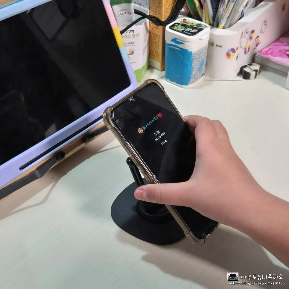 The writer's daughter using the stand to watch smartphone videos