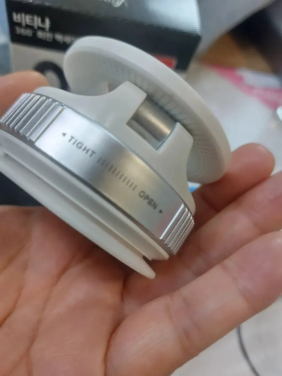 Metal circular ring for attaching to the back of a phone