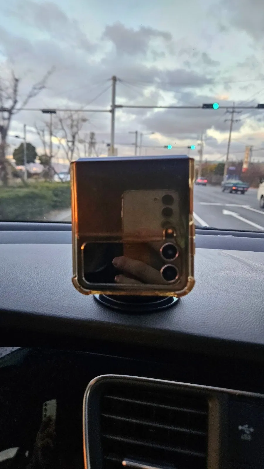 Car phone mount in use while traveling with a child