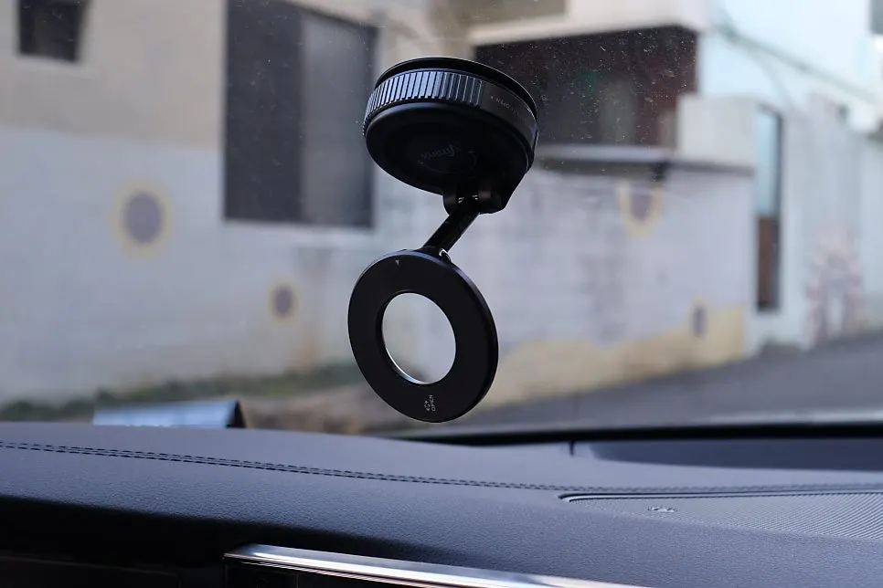 Stand attached to a flat surface in a car