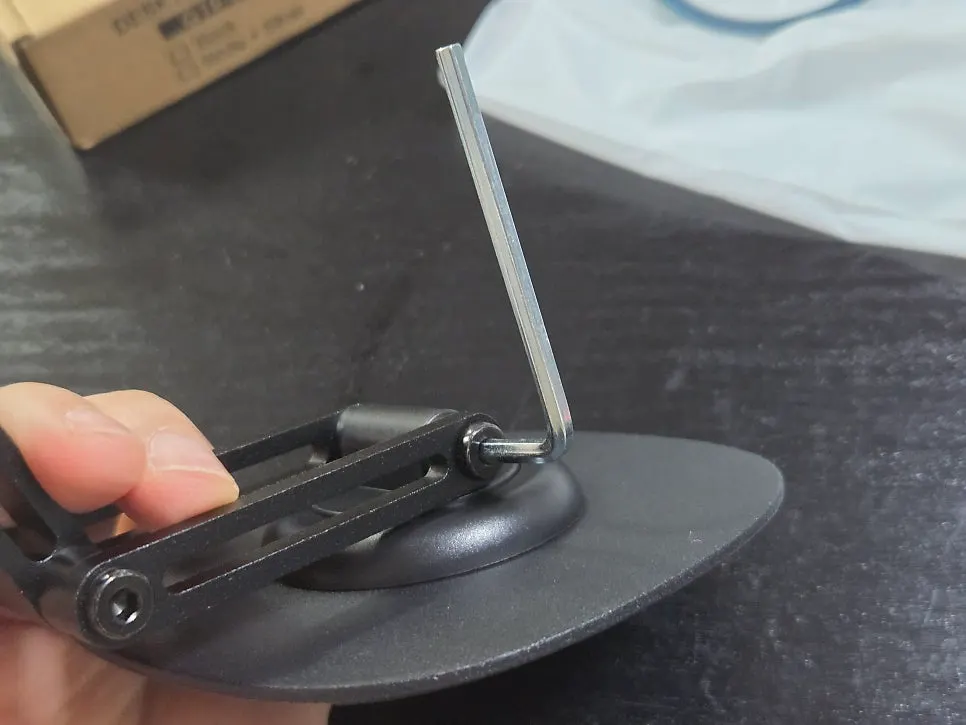 Loosening the stand screws to adjust the angle