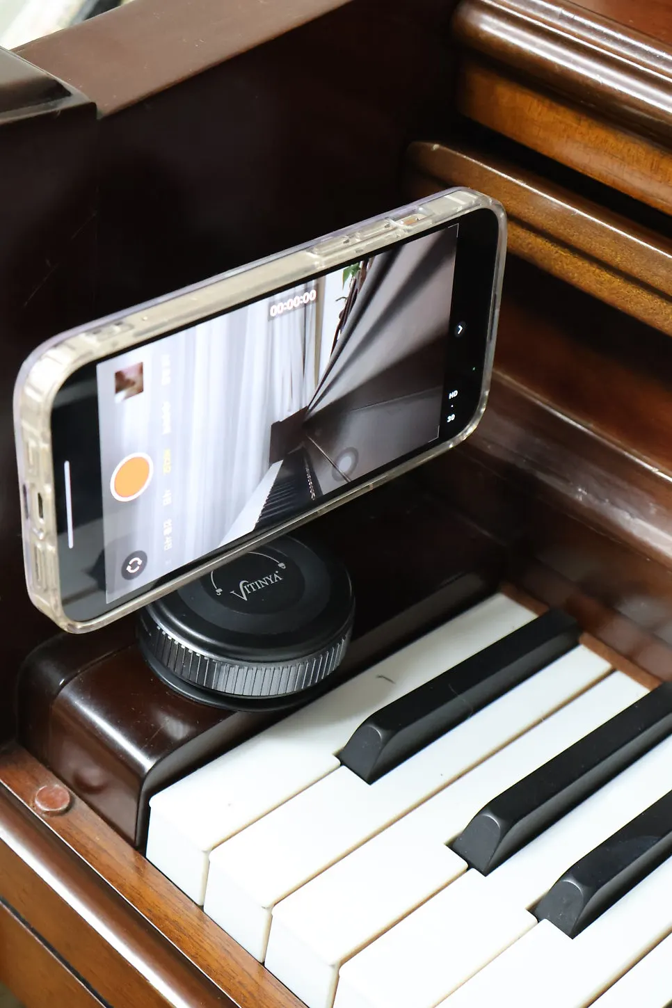 Phone stand propped up for music controls