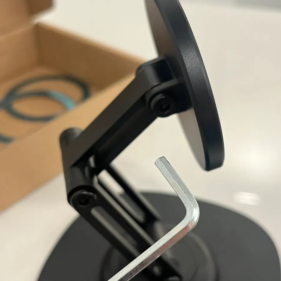 Stand with an included screwdriver for height adjustment