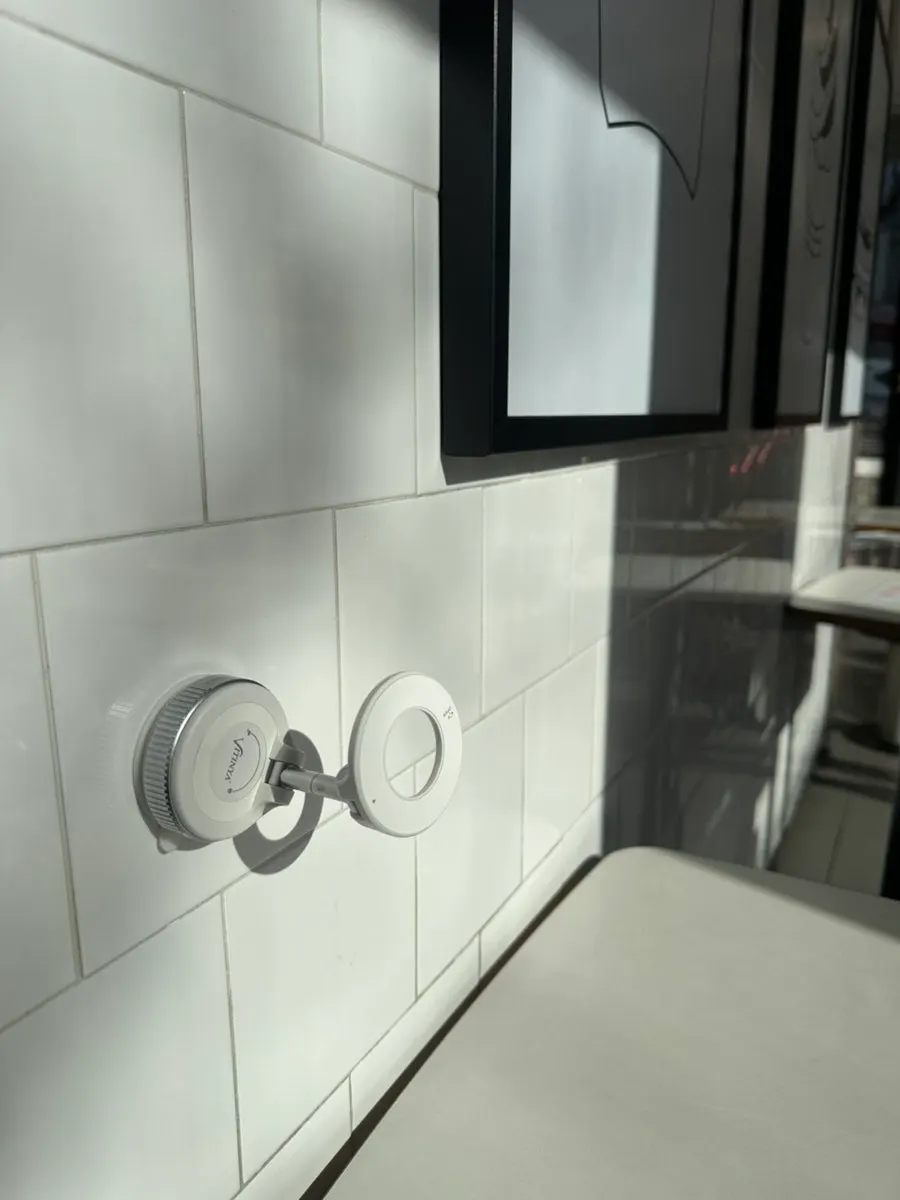 Holder suctioned in use at a café