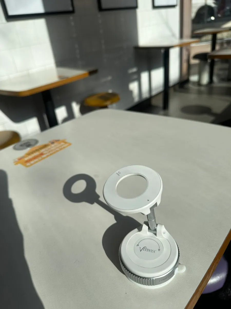 MagSafe holder attached to a glass wall