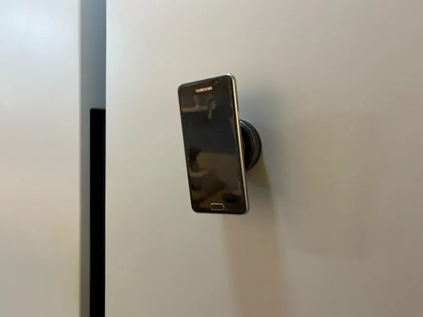 Phone mount attached to a flat kitchen surface