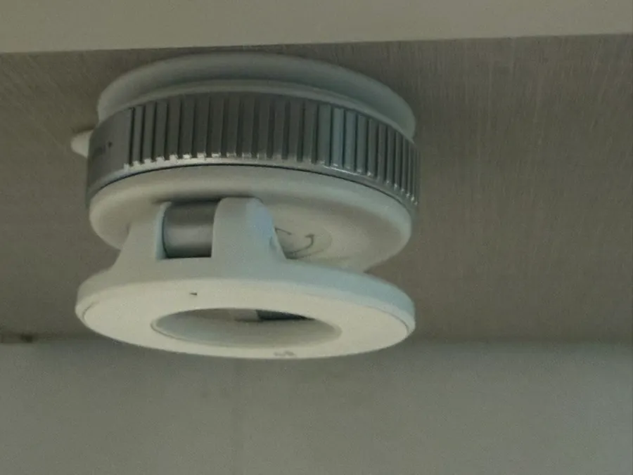 MagSafe phone mount attached to the side of a refrigerator