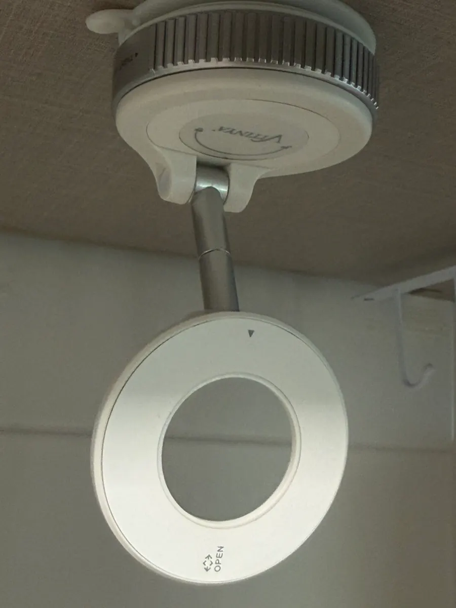 Foldable MagSafe phone mount used in the car and at home