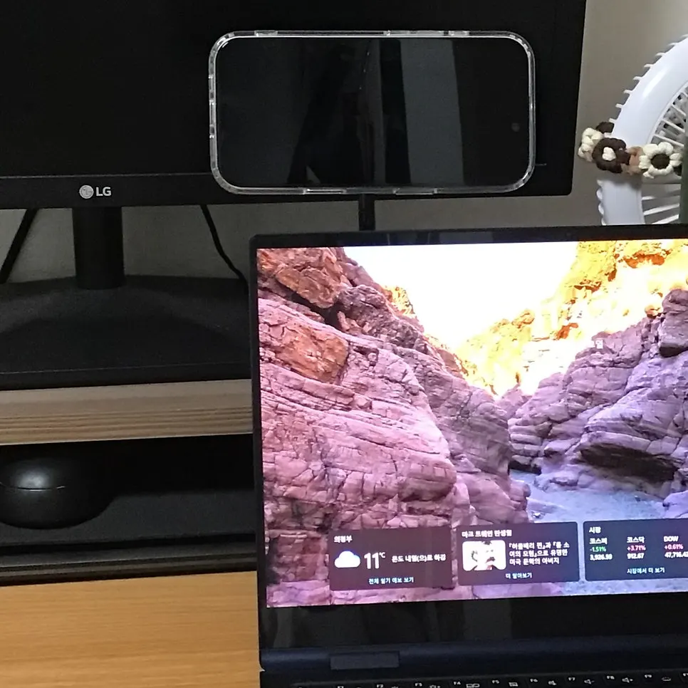 Laptop-mounted phone stand for using a phone as a second screen