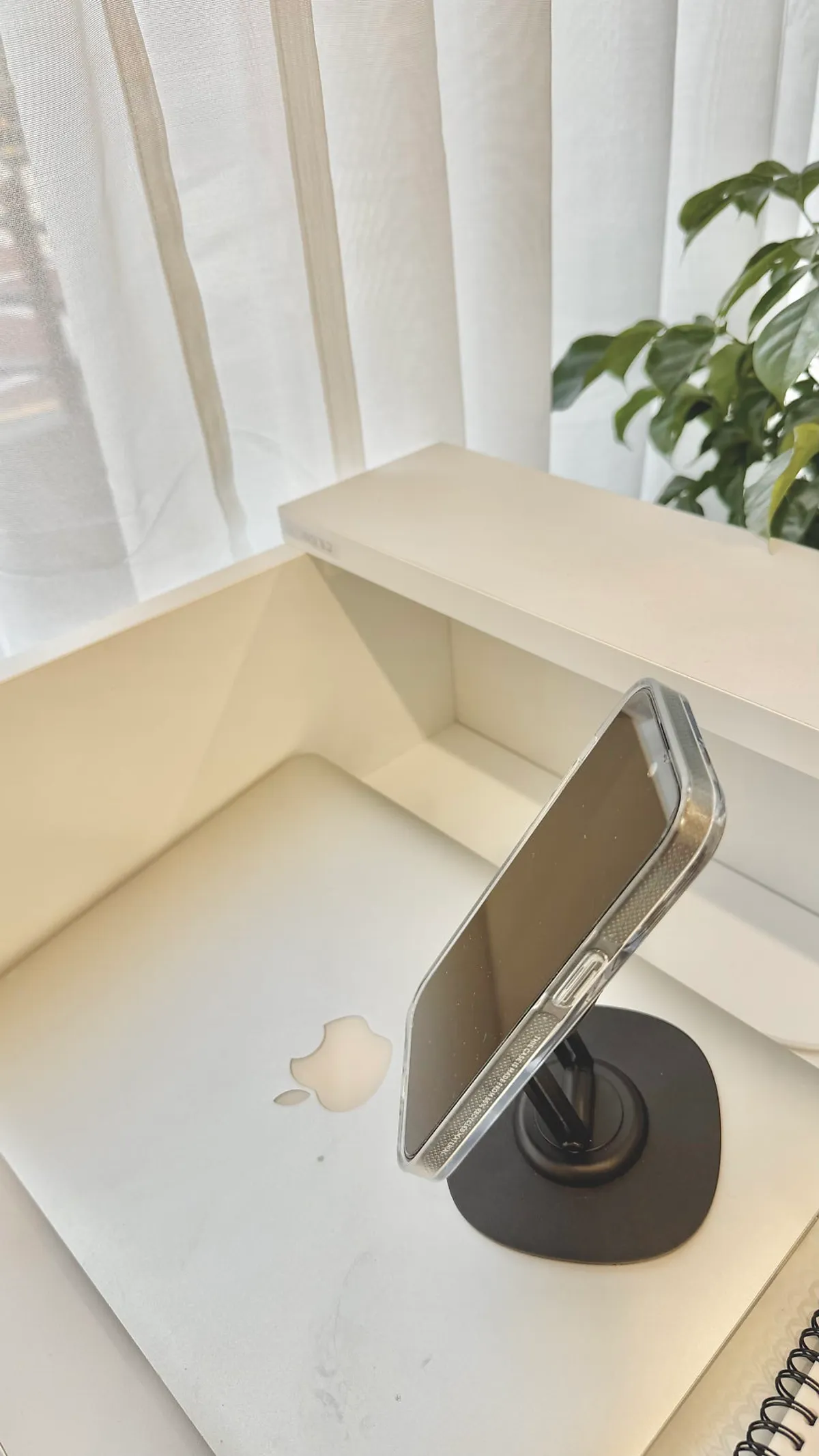 A Pro Max phone mounted securely on the stand