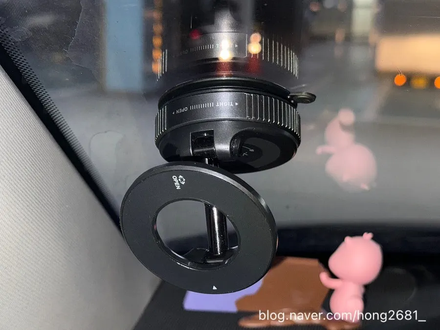 Installing the suction phone mount on a car window