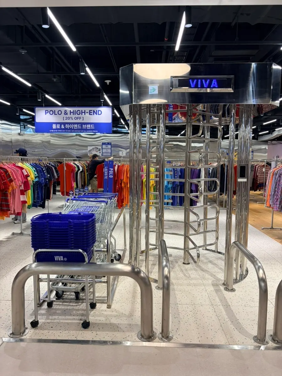 Clothing racks inside the warehouse-style store