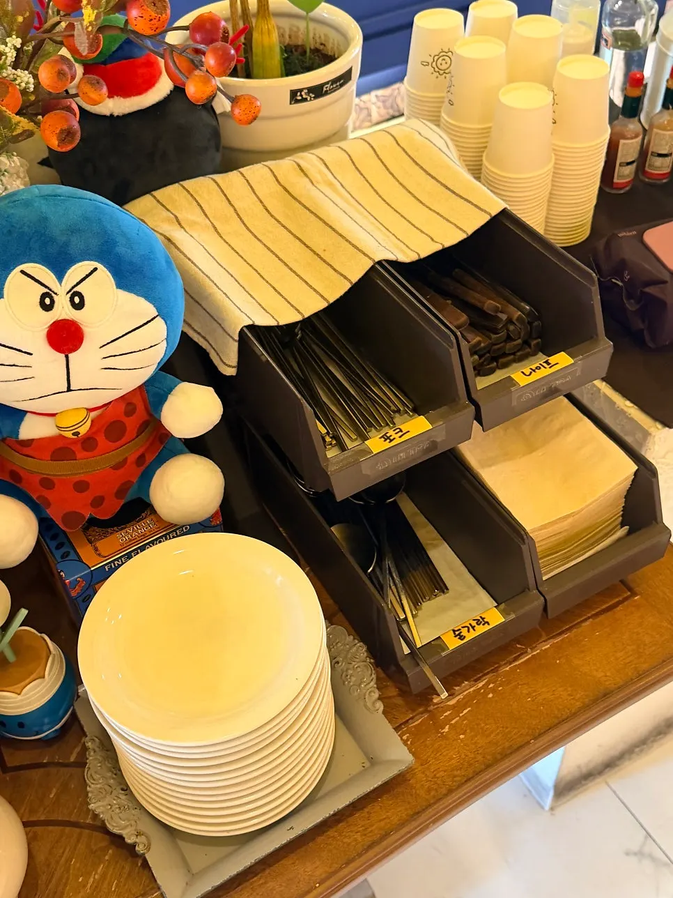 Self-serve bar corner with cutlery and sauces