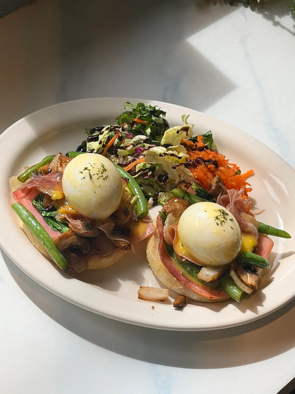 Plate of Vivid13's egg Benedict topped with two soft-boiled eggs