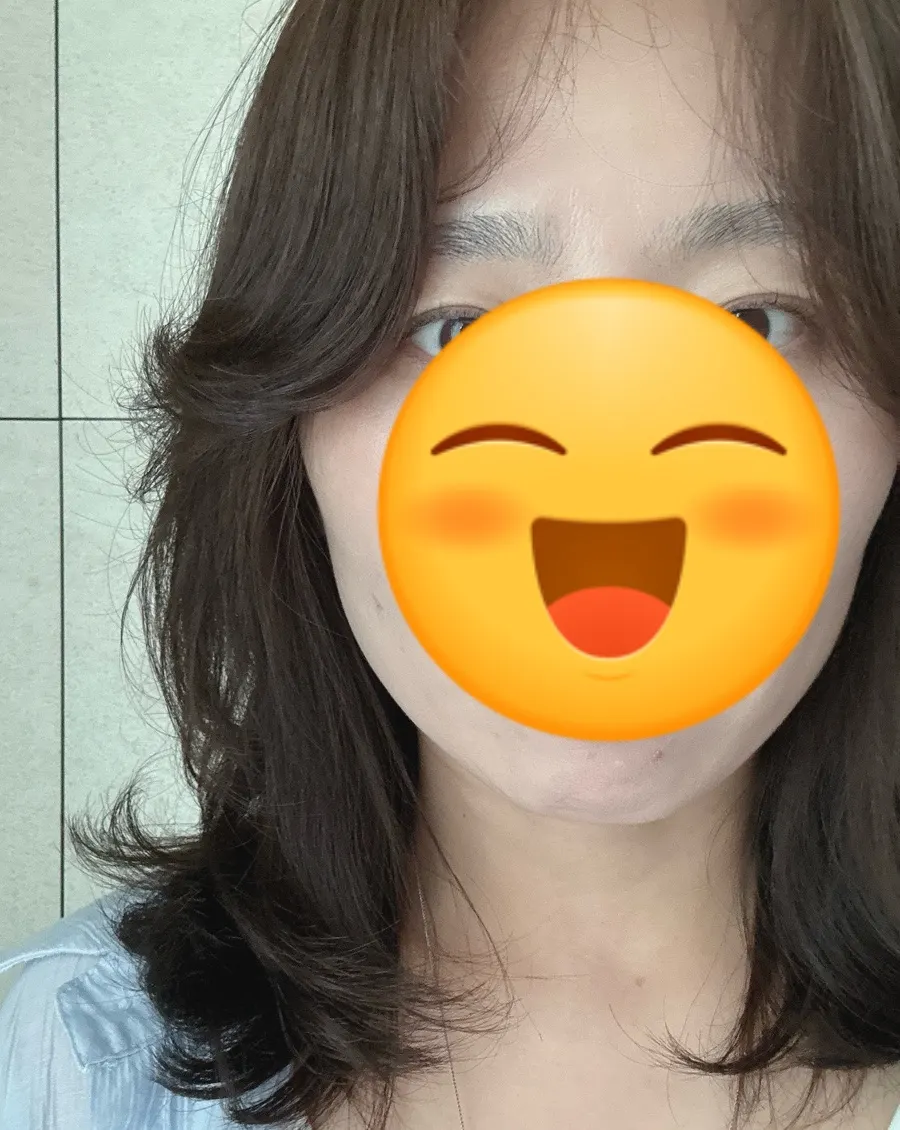 Hair after all-over light ash brown coloring