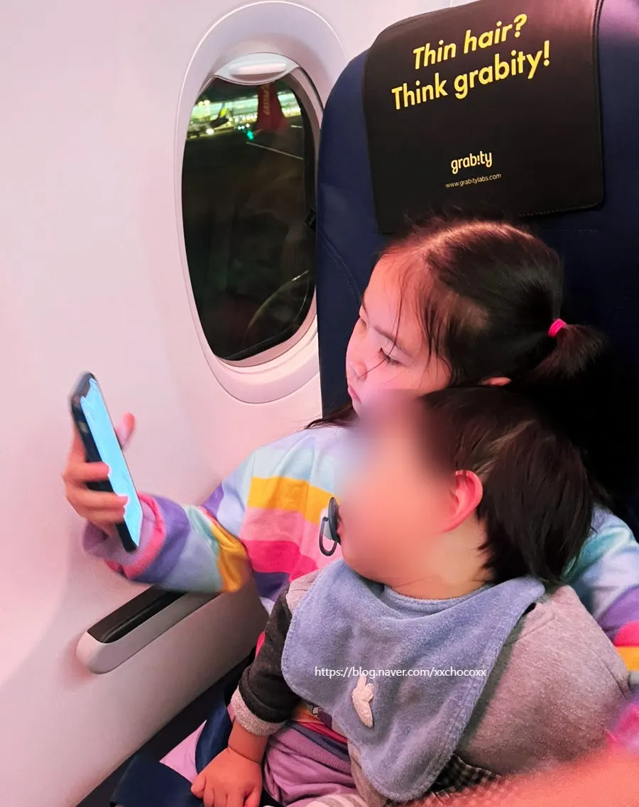 Boarding a plane to Nha Trang with children