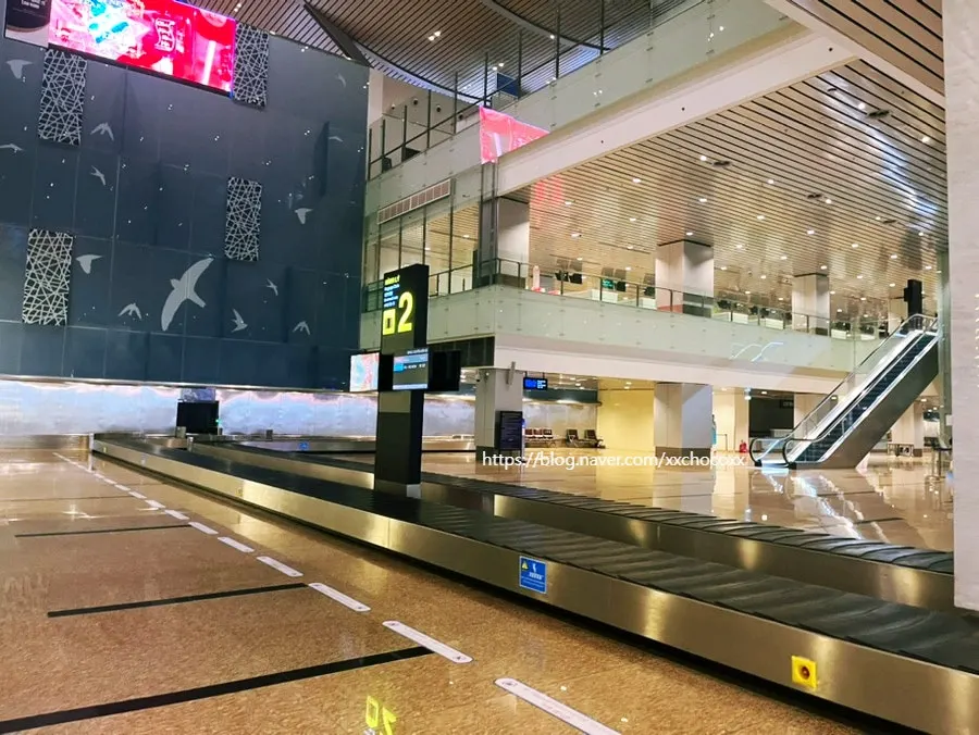 Waiting for baggage with children after immigration