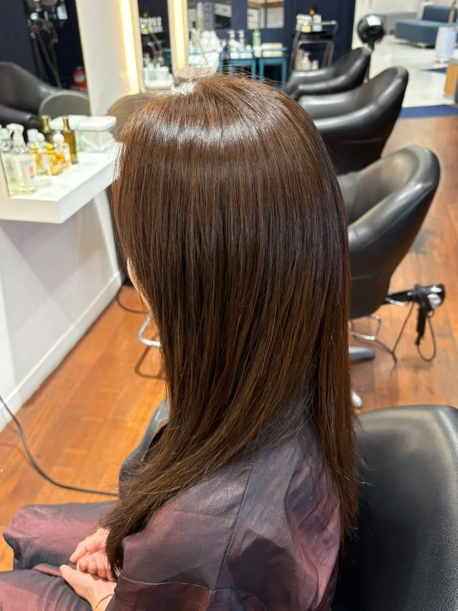 Calmed, smooth hair after the straightening treatment