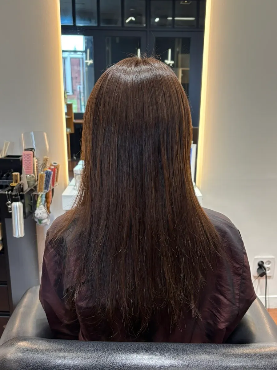 Back view of the finished semi-wavy hair straightening