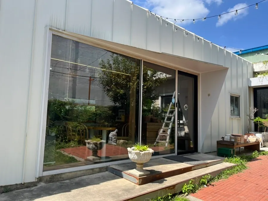 Entrance of Café Buajang with a 'We do coffee' sign