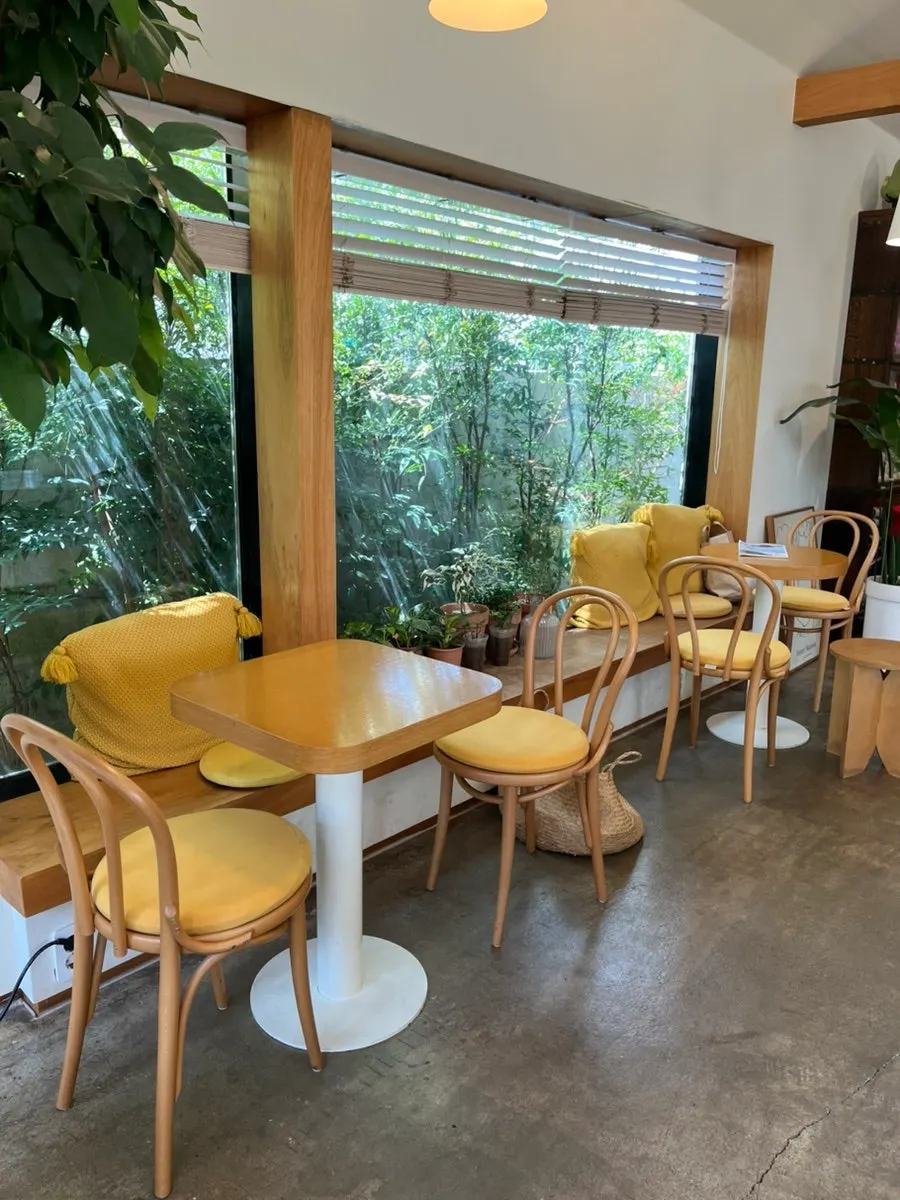 Interior of Café Buajang filled with plants