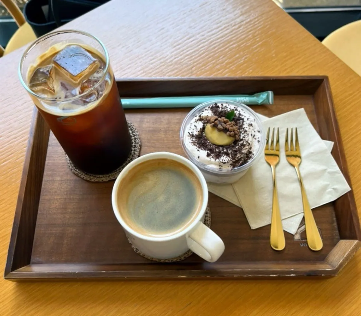 Seating and dessert spread at Café Buajang