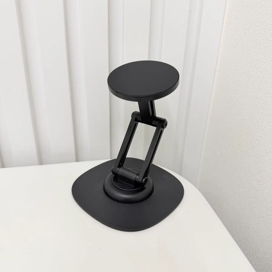 Stand used as a second screen beside a laptop