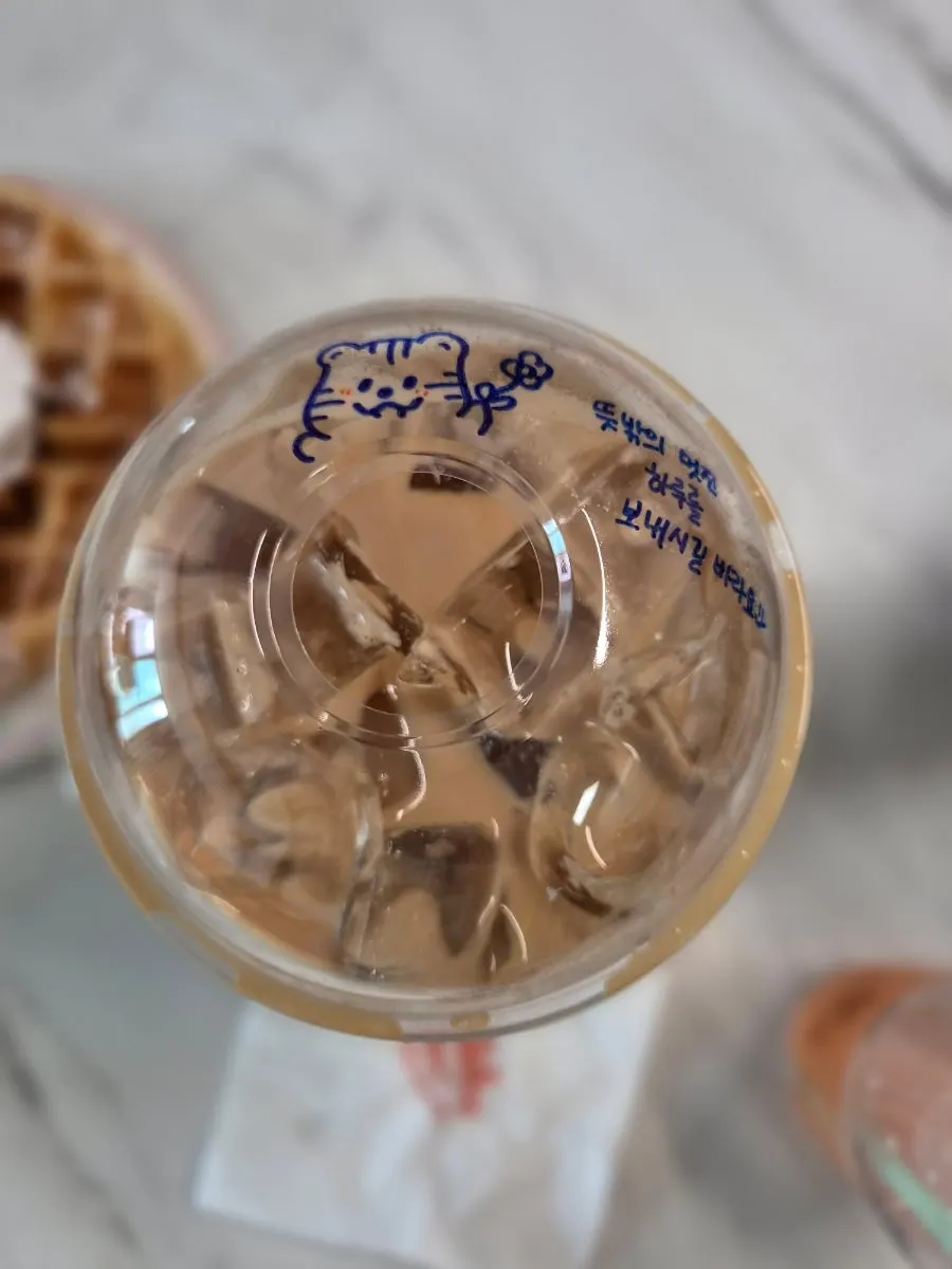 Cross-section of the strawberry choco waffle cut into four pieces on a plate