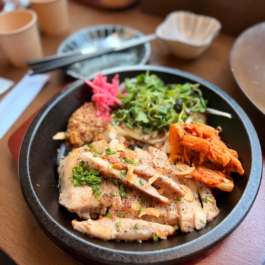 Plate of golden-seared pork jowl steak